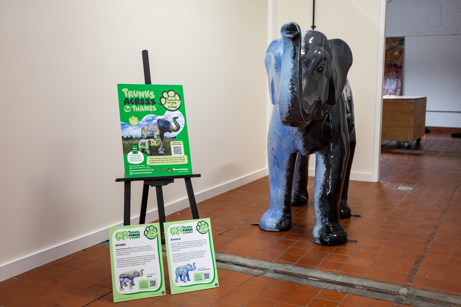 The sculptures installed next to promotion material