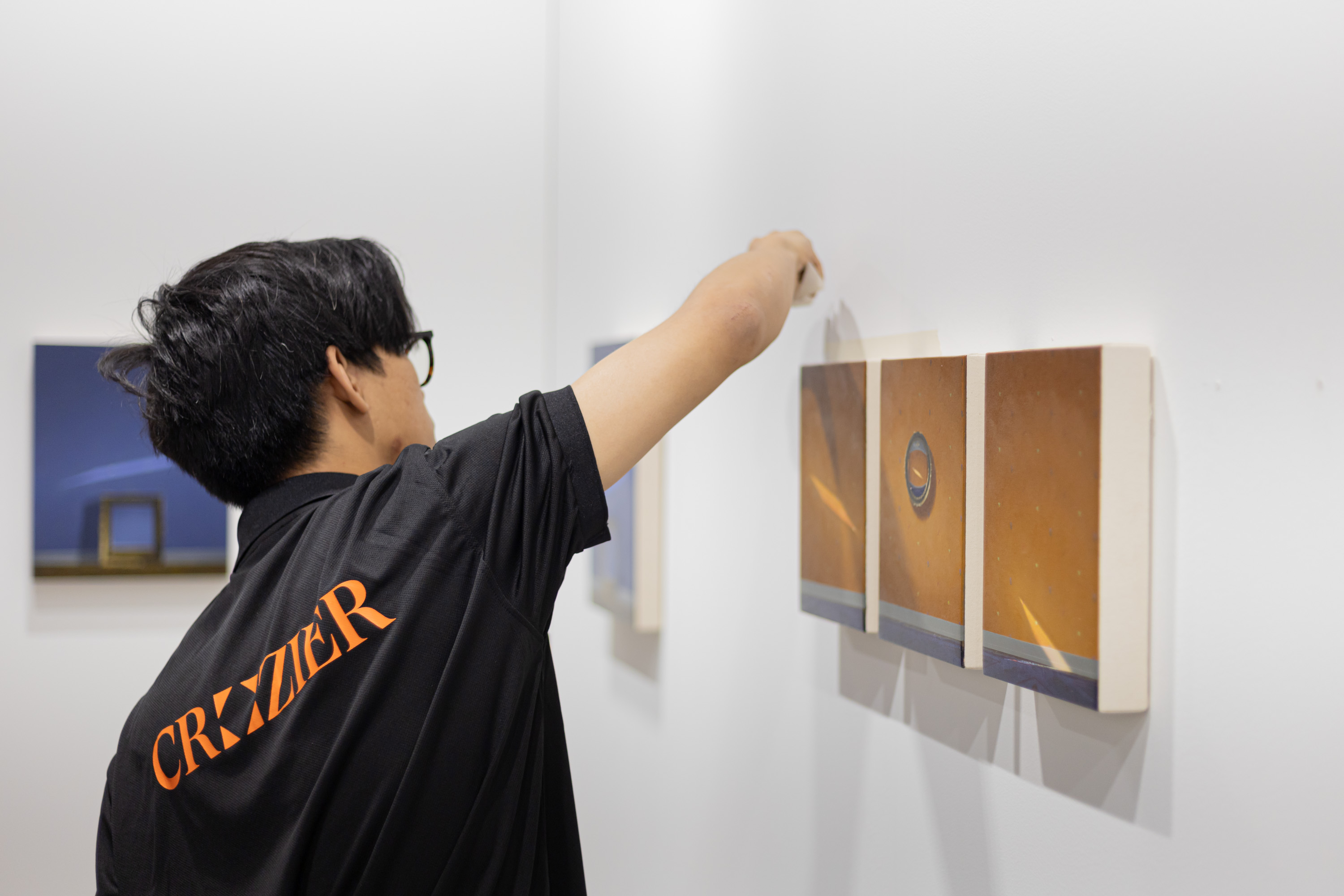 Crozier Art Handler installing a piece by Quentin James McCaffrey for Nicelle Beuchene gallery