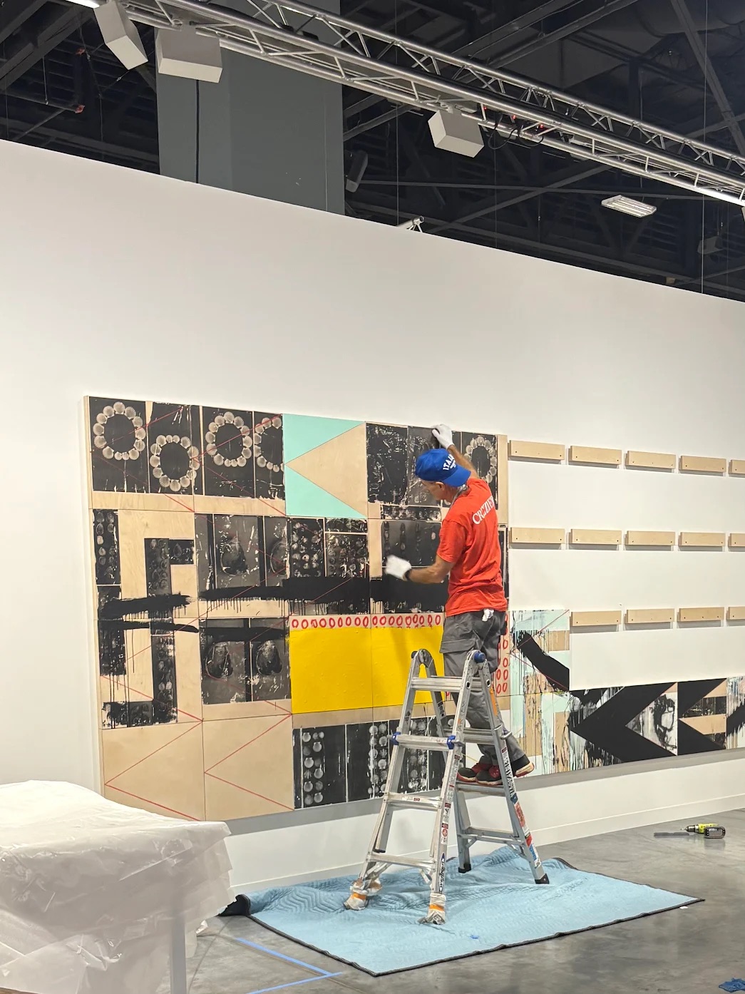 Crozier handler installing the artwork