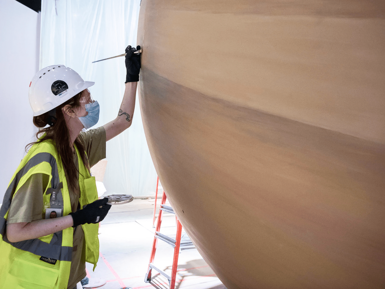 An artist touches up Saturn, which we eventually installed in interactive Kenneth C. Griffin 'Exploring the Planets' gallery. Photo courtesy of Jim Preston / The Washingtonian.