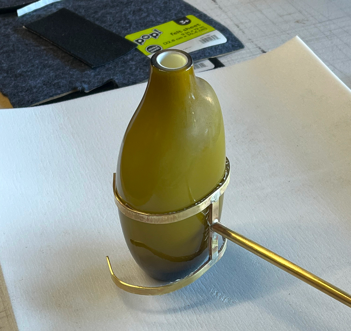 Yellow vase with brass handle 
